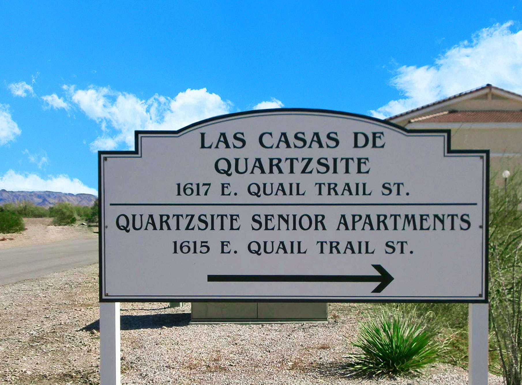 This image displays entrance marker photo of Las Casas de Quartzsite Apartments